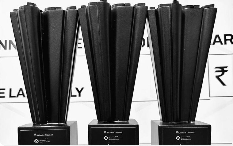 Three IGDC trophies lined up on a table